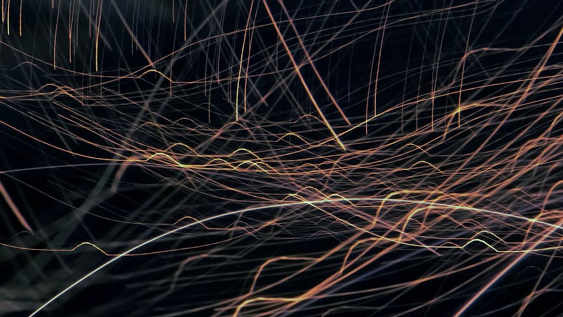 Abstract light patterns suggesting movement and energy.